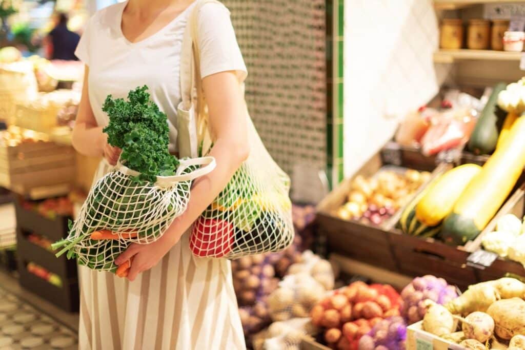 Women holding groceries in the zero waste shop.