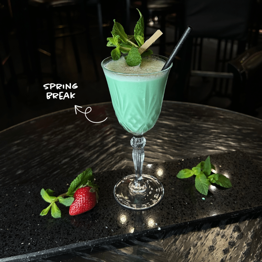 green spring cocktail on a table