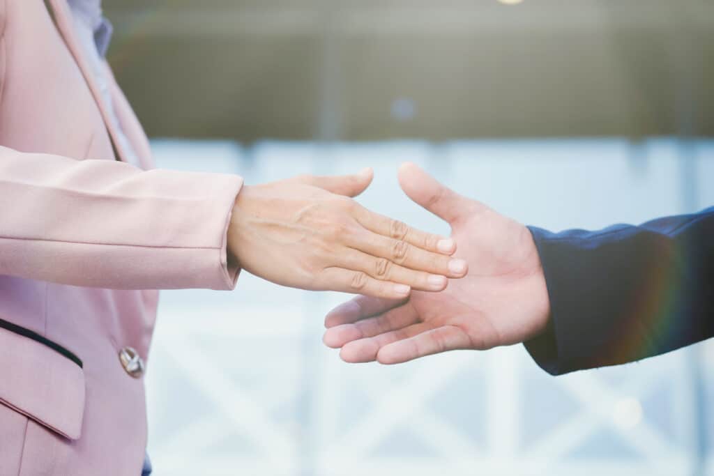 Business partnership meeting concept. Image businessmans handshake. Successful business peolple handshaking after good deal.